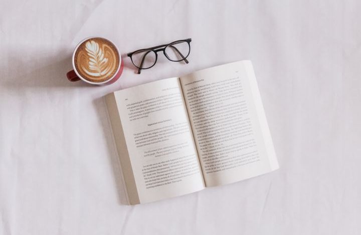 Book - book near eyeglasses and cappuccino
