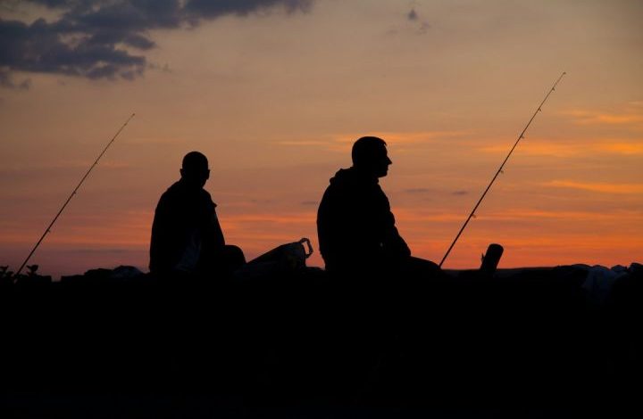 Fishing Tackle - silhoette of man fishing
