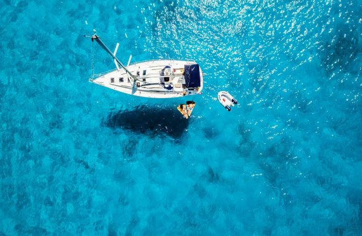 Boat - white yacht in middle of blue sea