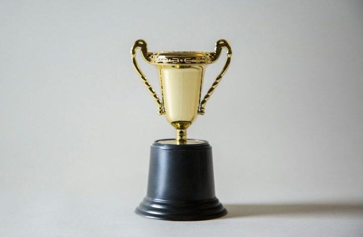 Win - yellow and white trophy