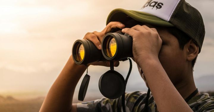 Binoculars - Man Looking in Binoculars during Sunset